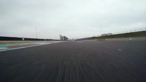POV racing on circuit going super fast on straight, high speed motorsport Video stock 133343498