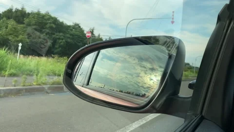 Pov Rear View Side Car Mirror driving along the road Stock Footage 137070596