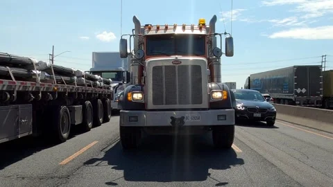 POV rear view view driving on freeway with car and truck traffic Stock Footage 204042822