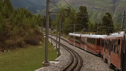 POV from Red Gornergrat Train Passing Through Scenic Mountain Landscape Stock Footage 301547649