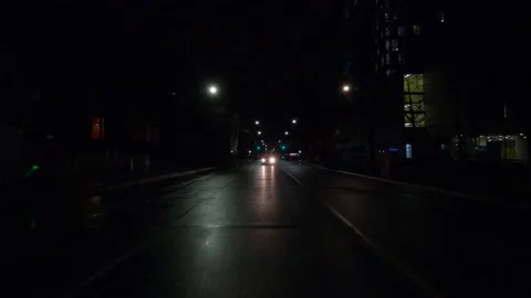 POV reverse night driving on dark Toronto city streets during COVID 19 pandemic Stock Footage 144934257