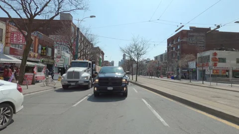 POV reverse shot driving in downtown Toronto city streets Stockbeeldmateriaal 151873448