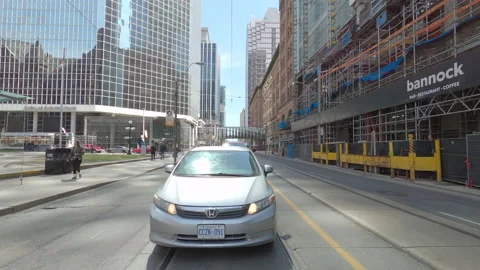POV reverse shot driving in downtown Toronto city streets Stockbeeldmateriaal 151880310