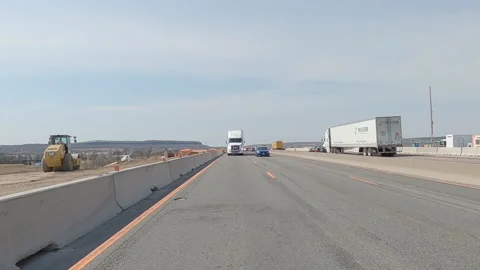 POV reverse shot driving on highway with truck and car traffic on nice day Vídeos de archivo 151897270
