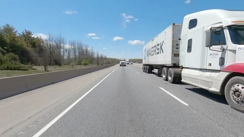 POV reverse shot driving plate on highway with truck and car traffic Stock-Footage 153641936