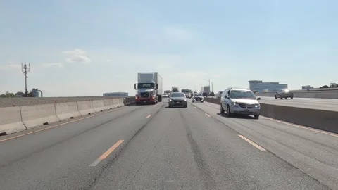 POV reverse shot driving plate tractor trailer trucks on highway del 스톡 동영상 156447409