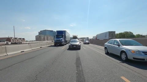 POV reverse shot driving plate tractor trailer trucks on highway del 스톡 동영상 156447623