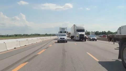 POV reverse shot driving plate tractor trailer trucks on highway del Video stock 156452448