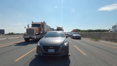POV reverse shot driving plate tractor trailer trucks on highway del Video stock 156479832