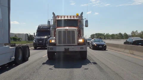 POV reverse shot driving plate on highway with truck and car traffic Видео 156480892