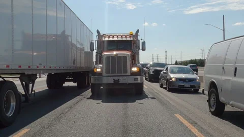 POV reverse shot driving plate on highway with truck and car traffic Видео 156481126
