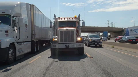 POV reverse shot driving plate on highway with truck and car traffic Vídeo Stock 156481462