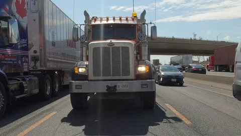 POV reverse shot driving plate on highway with truck and car traffic Видео 156481488