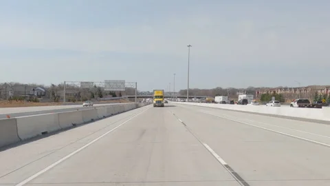 POV reverse shot driving platre on highway with truck and car traffic 動画素材 151893935