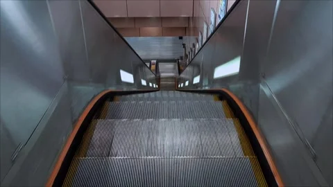 POV of riding an empty descending escalator in the MTR station Stock Footage 318728527