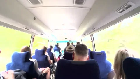 POV Riding On Full Bus With Passengers Driving Through Greenery Forest Bushland Stock Footage 237462292