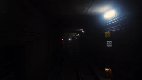 POV of riding subway as it crosses tracks and turns to the left to pull into Stock Footage 82367337
