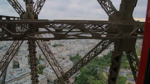 POV the rise inside the Elevator to the Eiffel tower - iron girders pass camera 스톡 동영상 73768754