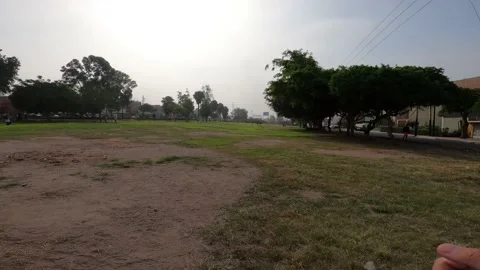 Pov running fast through a park in the daytime Stockbeeldmateriaal 149210180