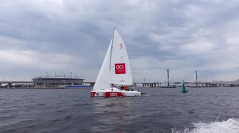 POV rush away from white sailing dinghy, white sail against cloudy sky Stock Footage 64674188