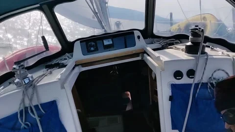 POV Sailing from the Helm, view from Cockpit, on Ocean near islands Stock Footage 144400711