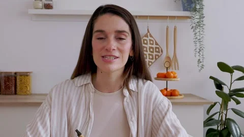 POV screen laptop view of young pretty woman talking on video call at home Stock Footage 312196377