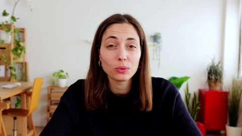 POV screen laptop view of young pretty woman talking on video call at home Stock Footage 313280658