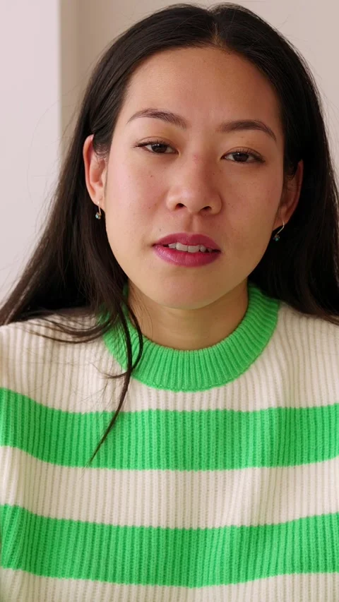 POV screen view of young asian woman listening on video call Stock Footage 246984152