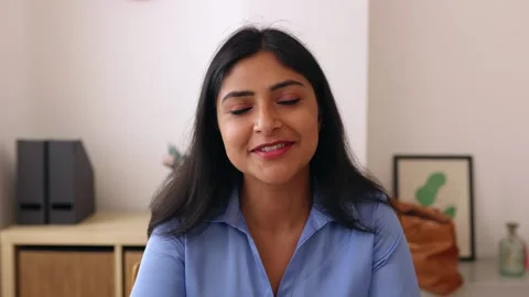 POV screen view of young indian businesswoman talking on laptop video call. Stock Footage 246366922