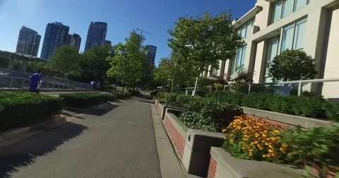 Pov on the seawall towards david lam park yaletown Stock Footage