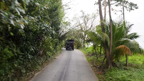 POV shot along a bumpy road in a jungle in Koh Samui Stock Footage 302147987