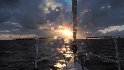 POV shot. Bow moving along the waves towards bright sun. Amazing seascape on Stock Footage 88409095