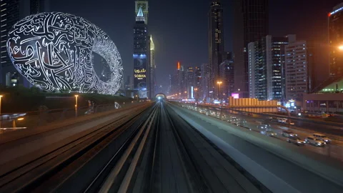 POV Shot from Dubai Metro Train Showing the Iconic Museum of the Future at Night Stock Footage 319015783