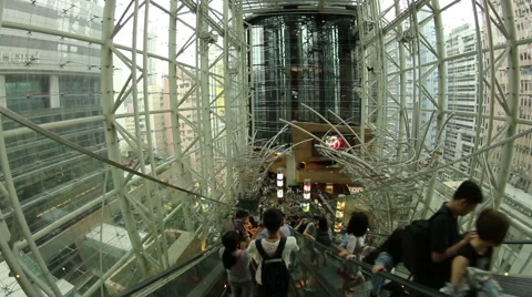 POV shot of an escalator going down in Langham Place mall Stock Footage 54567345