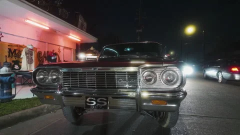 POV shot in front of a chevy Impala lowrider car, evening in Houston, Texas, USA Stock Footage 312093998