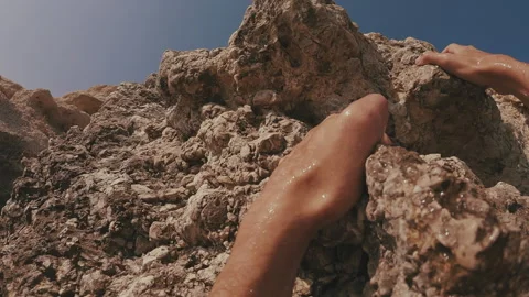 POV shot, hands of guy moving up rock, Close up Stock Footage 250253483