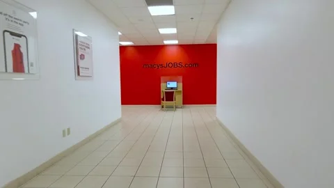 POV shot inside a Macy store reveals Macy's job computer station. Stock Footage 297928424