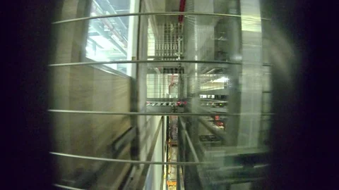 POV shot from inside a plastic box travelling inside an automated warehouse Stock Footage 112268162