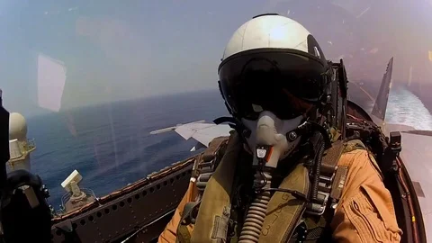 POV shot from jet fighter plane landing on an aircraft carrier. Stock Footage 74797128