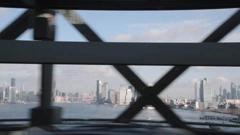 POV shot looking out the window while crossing the Williamsburg Bridge on the 스톡 동영상 327803073