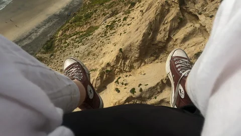 POV shot paragliding over cliffs of Torrey Pines Gliderport, Pacific Costline CA Video stock 241775176