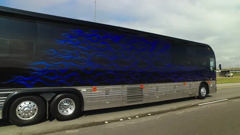 Pov Shot Of Rv Bus With Flame Pattern On Road During Sunny Day - New Orleans, Stock Footage 219386232