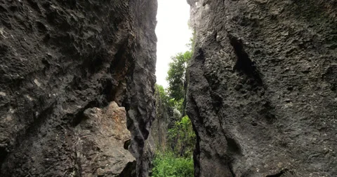 POV shot of scenic stone path through Shilin Stone Forest in Kunming Vídeo Stock 329488683