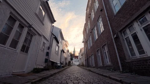POV shot. Slow mo. Moving forward along narrow European street from paving Stock Footage 87984356