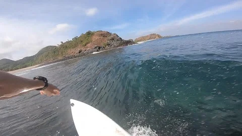 POV shot of surfer riding wave in Bali Stock Footage