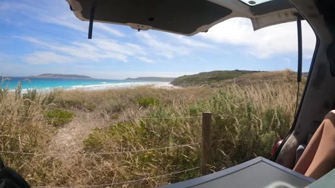 POV shot from van with sandy beach and ocean view in Australia. Open Trunk Stock Footage 273553272
