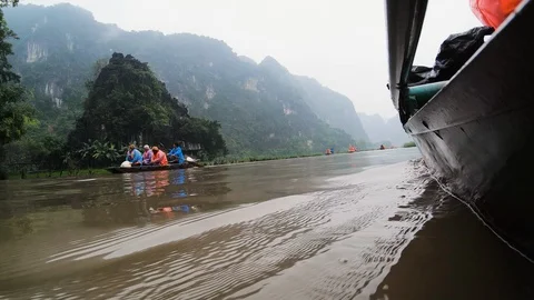 POV from side of boat floating on top of red river passing other tourists Stock Footage 147354412