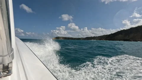 POV-Side of boat at speed passing Tintamarre Island at St Martin Video stock 229909804