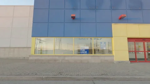 POV side view closed and bankrupt stores in Toronto COVID 19 pandemic recession Stock Footage 144073571