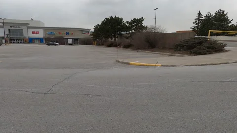 POV side view closed retail shopping mall in COVID 19 pandemic lockdown Vídeo Stock 147258309